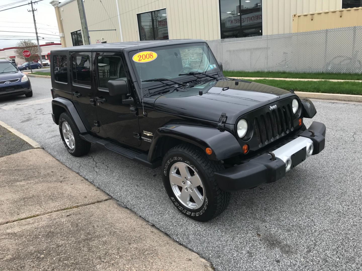 2008 Black /Black Jeep Wrangler Unlimited Sahara 4WD (1J8GA59198L) with an 3.8L V6 OHV 12V engine, Automatic transmission, located at 577 Chester Pike, Prospect Park, PA, 19076, (610) 237-1015, 39.886154, -75.302338 - Photo#3